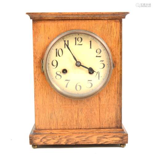 An Edwardian oak mantel clock