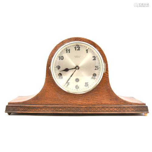 A 1940s oak mantel clock,