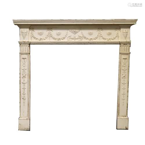 An Edwardian painted pine fire surround, in the Adam style