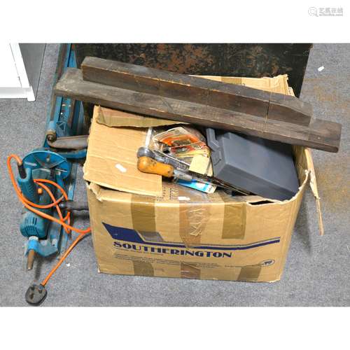 A number of hand tools, and a Black and Decker benchtop lathe, contained within a trunk.