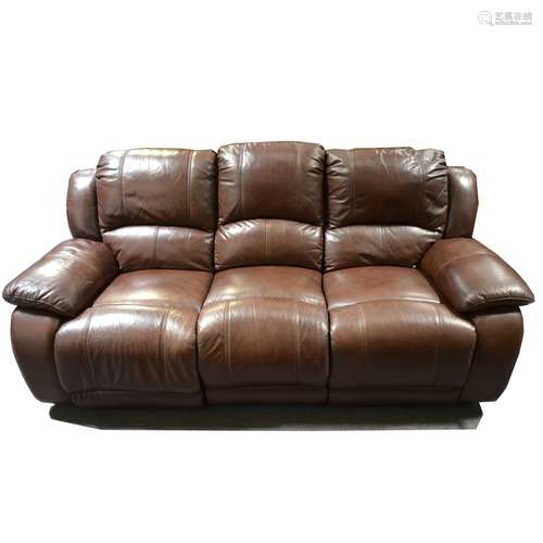 A contemporary two-piece brown leather reclining lounge suite