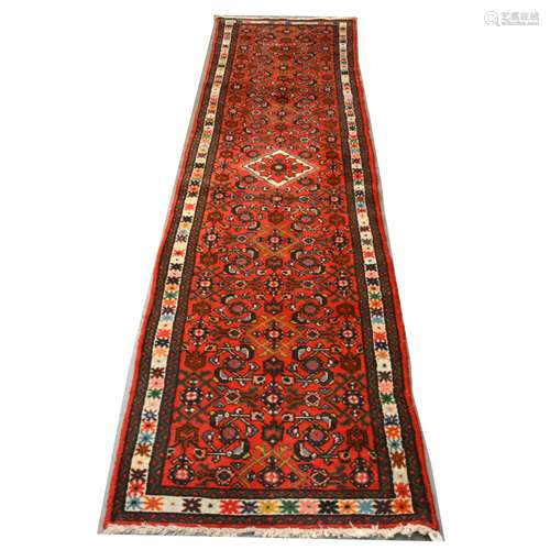 A Persian runner and three mats