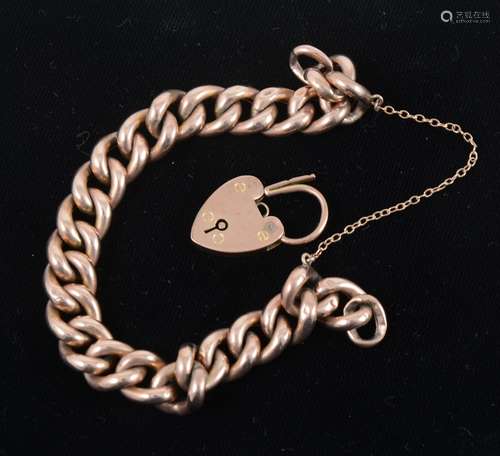 A yellow metal hollow curb link chain, marked 9ct, with 9ct gold padlock clasp.