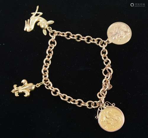 A 9 carat yellow gold bracelet with three charms and a Half Sovereign