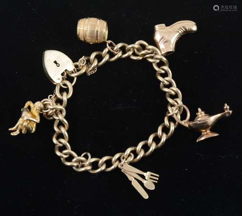 A 9 carat yellow gold solid curb link charm bracelet.