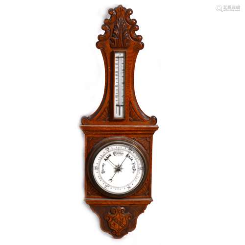 A VIctorian carved oak case barometer