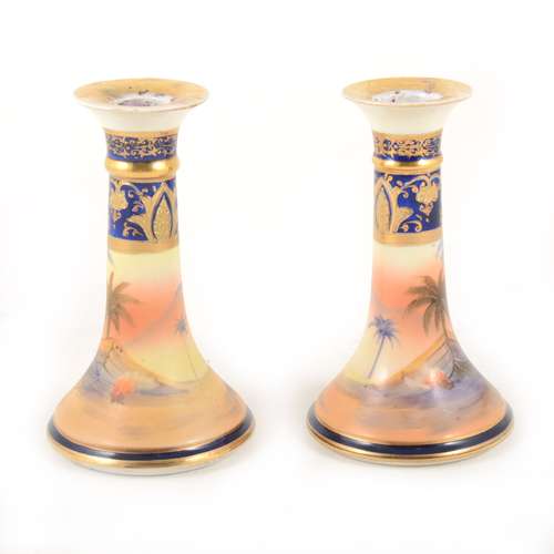 A pair of Noritake porcelain candlesticks