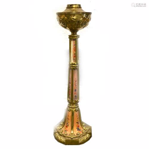 A brass oil lamp with porcelain panelled column