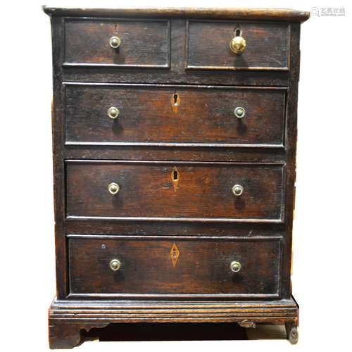 A 19th Century miniature oak chest of drawers