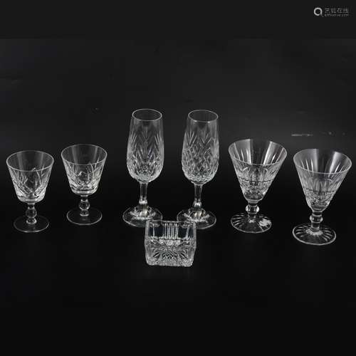 Eight Waterford Crystal wine glasses, six sherry glasses, and other stemware.