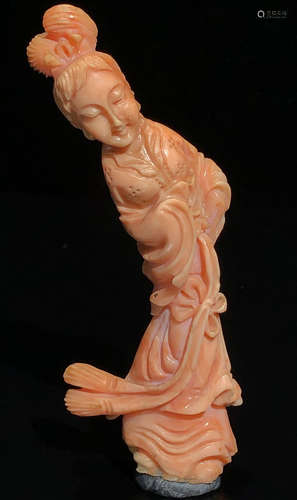 A CORAL CARVED FIGURE SHAPED STATUE