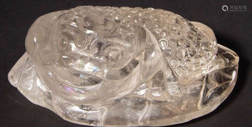 A CRYSTAL CARVED PAPERWEIGHT