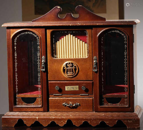 A WOOD CARVED MUSIC BOX.