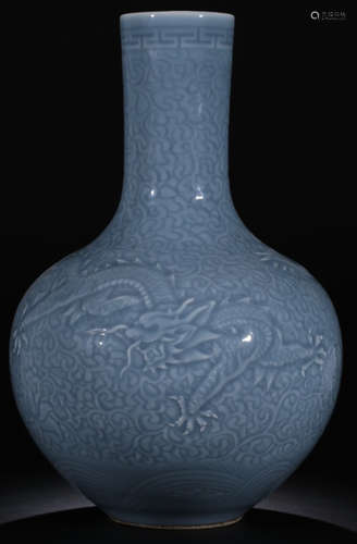 A SKY BLUE GLAZE VASE WITH DRAGON PATTERN