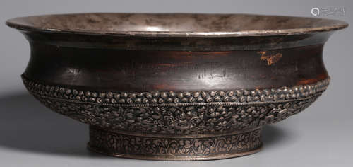 A TIBETAN SILVER WITH WOOD AUSPICIOUS PATTERN JAR