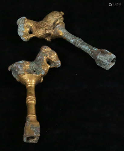 A GILT BRONZE CASETD PENDANT