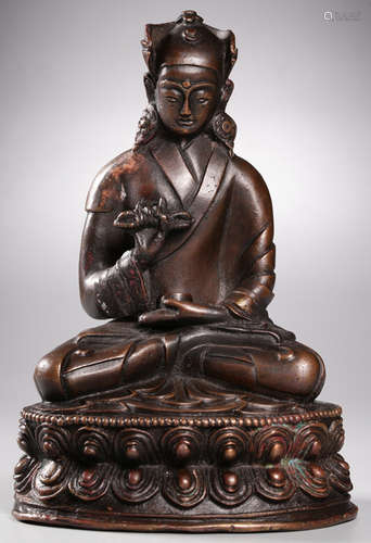 A COPPER CAST TIBETAN BUDDHA STATUE