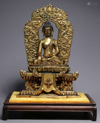 A GILT BRONZE CASETD SAKYAMUNI BUDDHA STATUE