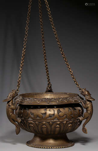 A COPPER CAST FLORAL PATTERN HANGING CENSER