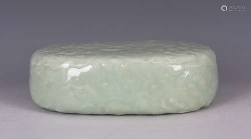 CELADON GLAZED AND IMPRESSED 'CLOUD' PAPER WEIGHT