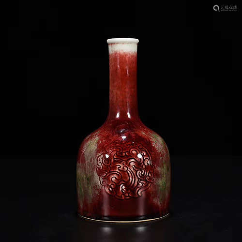 A CHINESE CARVED PORCELAIN BELL-SHAPED VASE