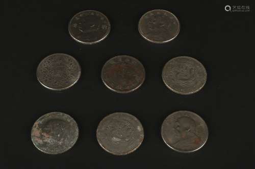 A Group Of Eight Silver Coins