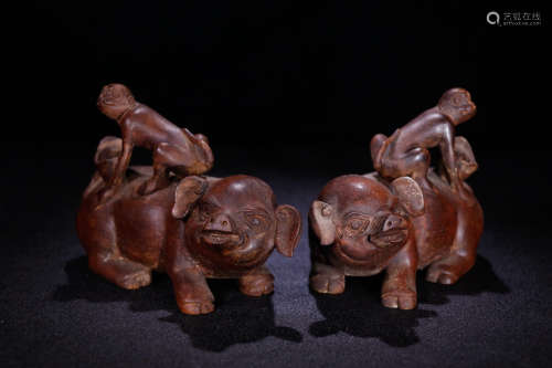A Chinese Eaglewood Carved Pig Monkey Ornaments