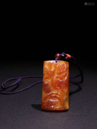 A Chinese Amber Carved Pendant