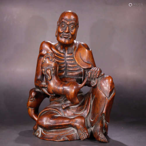 A Chinese Eaglewood Carved Arhat Statue