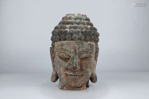 A Chinese Wood Carved Buddha's Head Ornament