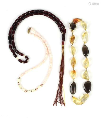 A mixed group of costume jewellery including a Bakelite necklace, citrine and glass bead necklace,