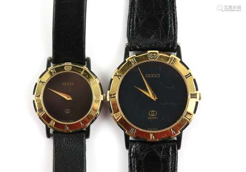 Gucci gentleman's reference 3200 wristwatch with black dial, and a ladies 3200L wristwatch, the gilt