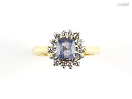 Sapphire and diamond cluster ring, central cushion cut sapphire, estimated weight 1.15 carats, set