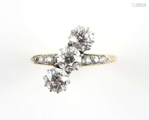 Edwardian trilogy ring, set with old cut diamonds and diamond set shoulders, estimated total diamond
