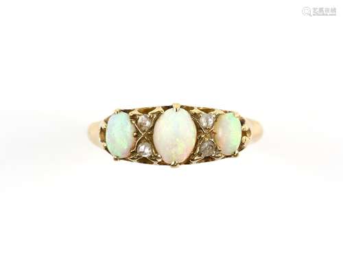 Antique opal ring, set with three oval cabochon cut opals, and four rose cut diamonds, mount stamped