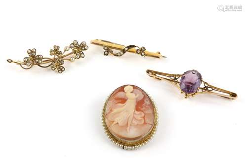 Four brooches, one set with seed pearls in a clover leaf motif, testing as 14 ct, another set with