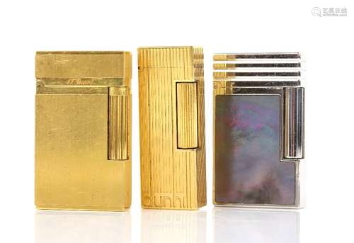 Three vintage cigarette lighters, one S.T. Dupont lighter, inlayed with black mother of pearl in