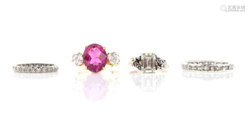 Four rings, one Swiss cut diamond full eternity, size K, a pink and white paste three stone, size N,