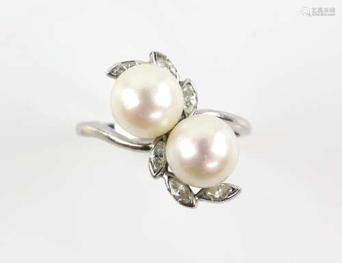 Cultured pearl and diamond twist ring, set with six marquise cut diamonds, estimated total diamond