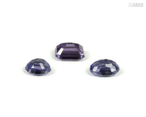 Three synthetic colour change sapphires, one rectangular step cut 11.5 x 8.7 x 6.55mm, an oval cut