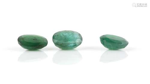 Three oval cut loose emeralds, one with an estimated weight 2.95 carats, another 2.26 carats and 2.