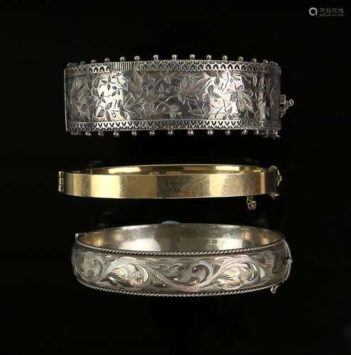 Victorian hinged bangle, engraved ivy motif, concealed clasp and safety chain, with a similar modern