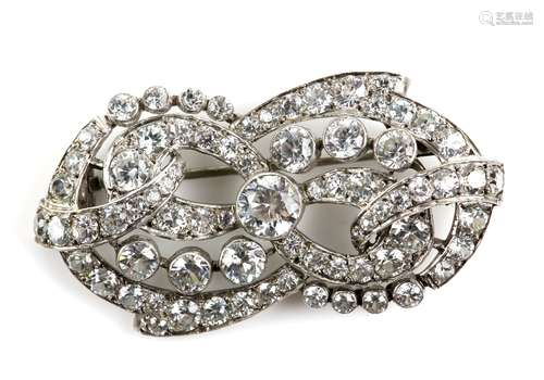 French mid 20th C brooch, set with round cut white zircons in scrolling bow motif, pin and roll