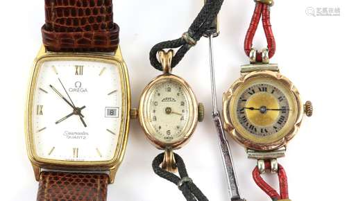 Two ladies 9 ct gold watches on fabric and leather straps, and an Omega Seamaster Quartz Gentleman's