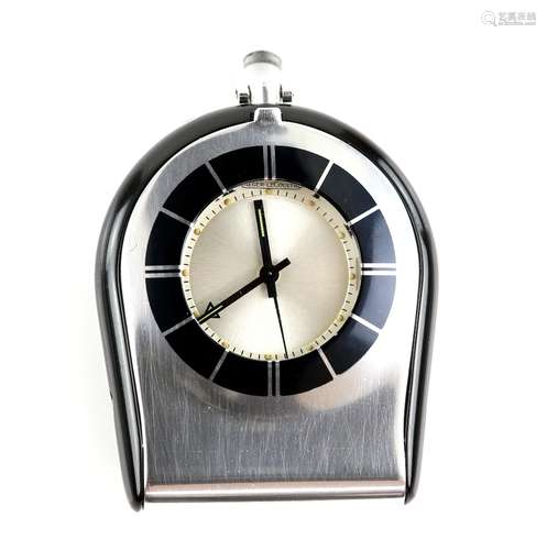 Jaeger Le Coultre travel alarm clock, in a hinged stainless steel case, with black enamel bezel