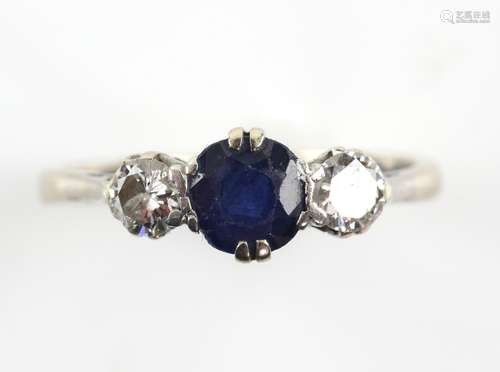 Sapphire and diamond three stone ring; circular faceted sapphire weighing approximately 0.87 carats,