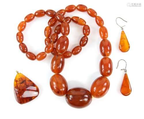 Amber earrings and pendant and a faux amber necklace, length 63 cm . CONDITION, good, necklace