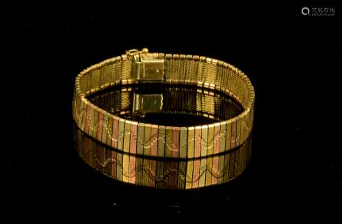 Tri coloured gold bracelet; alternating panels of 9 ct yellow, white and rose gold with repeating