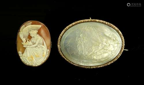 Two brooches, a large carved mother of pearl brooch scene, in ornate engraved frame, testing as 9