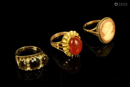 Three rings, one vintage oval cabochon cut carnelian ring, ornate mount stamped 14 ct, ring size